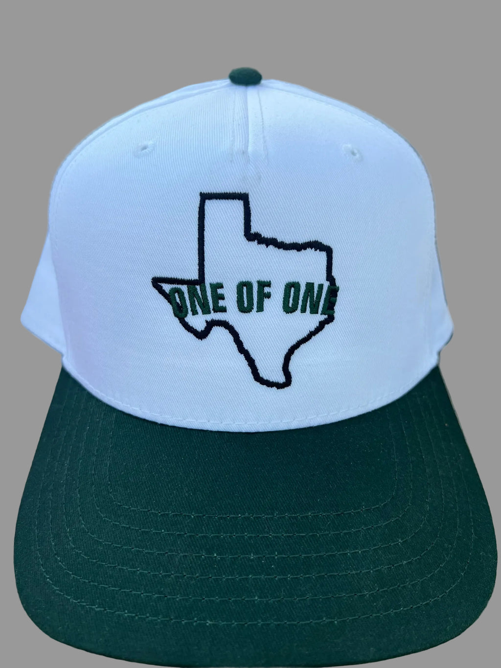 One of One Texas Logo performance caps
